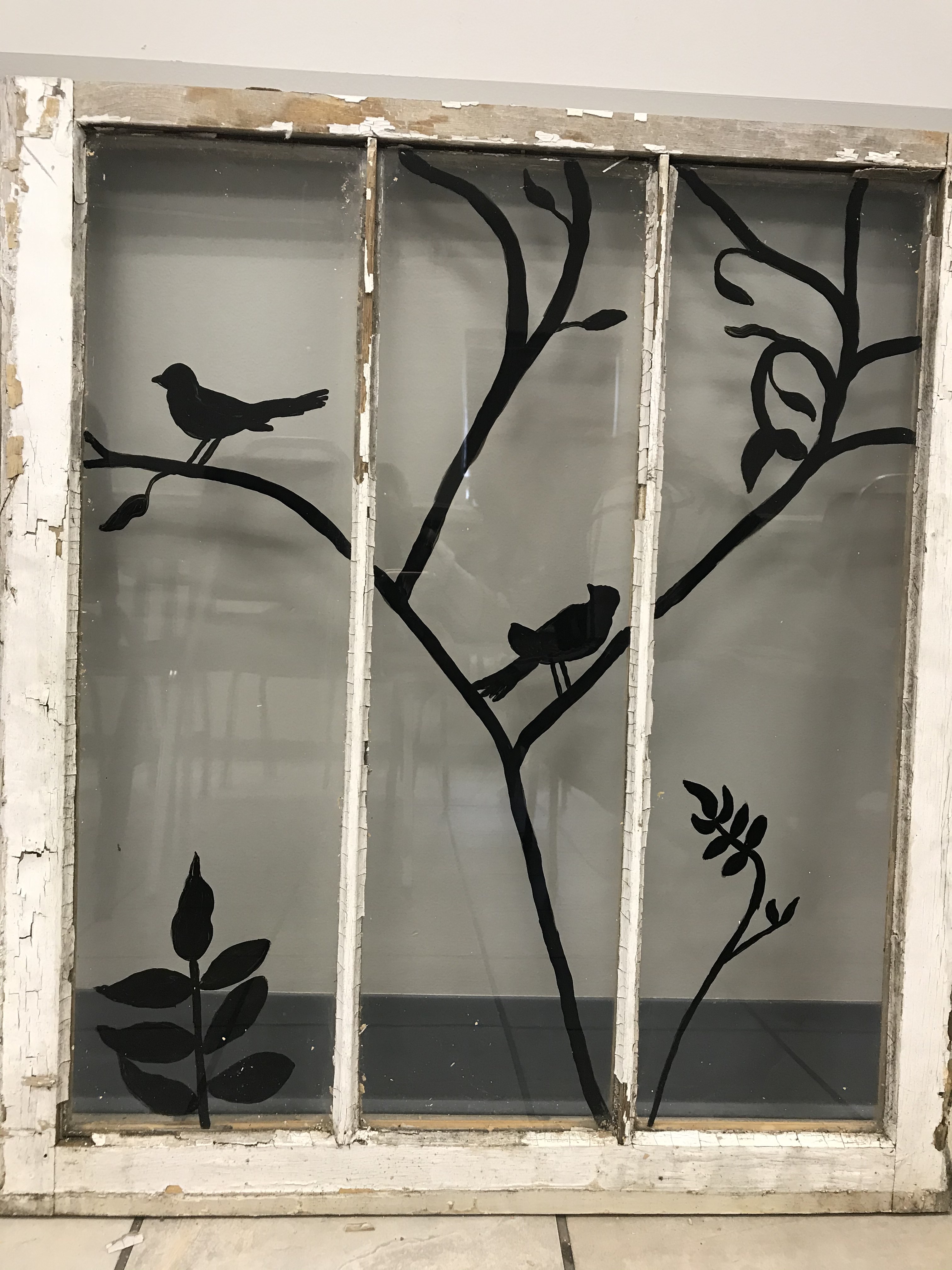 Silhouette of birds painted on a window