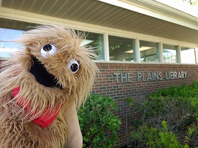 Puppet in front of The Plains Public Library 