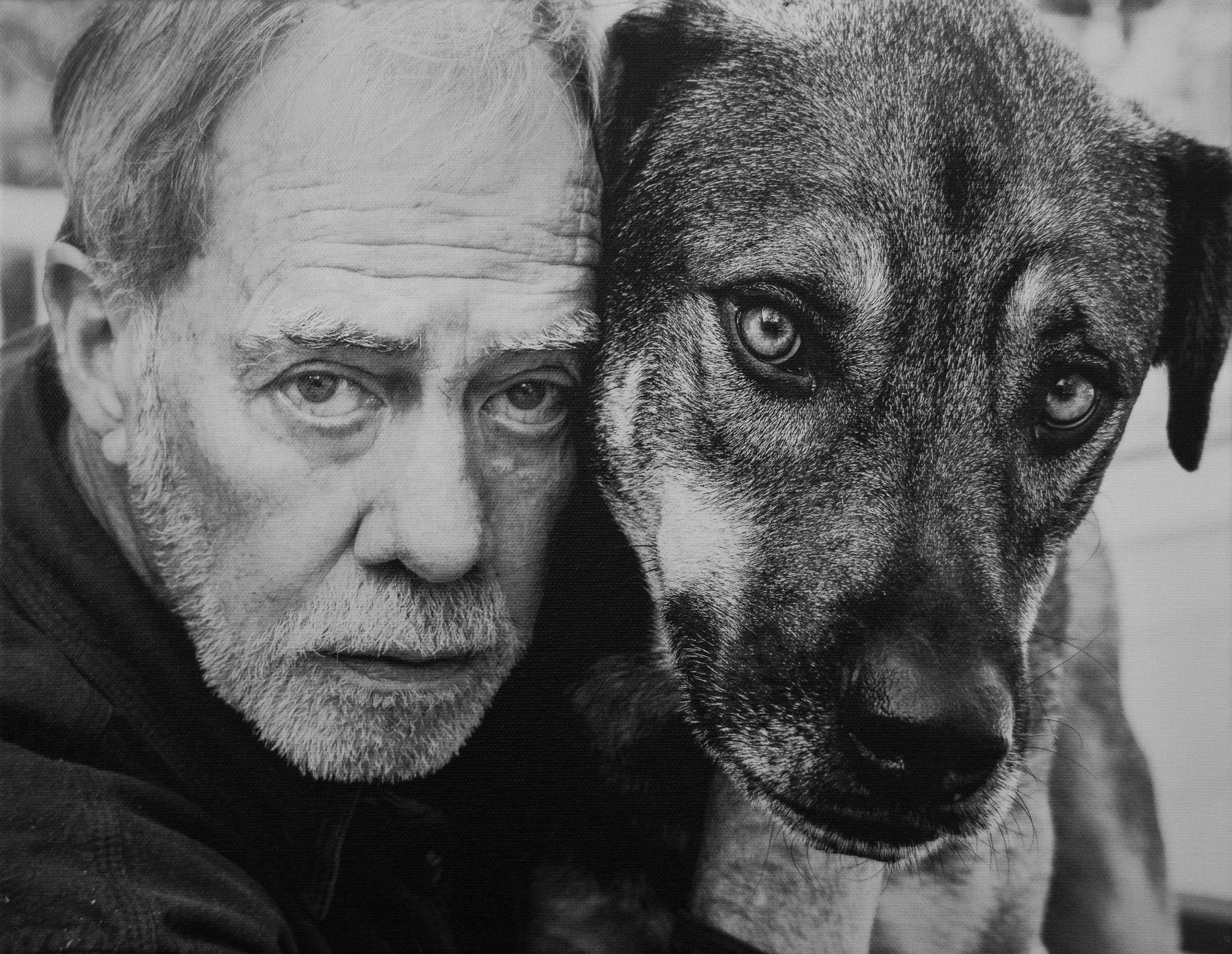 Image of featured artist, Brian Blauser, and his long-time field companion, Taj.