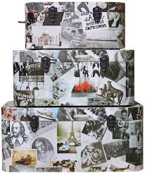 Three rectangular boxes are stacked on top of one another, with the largest on the bottom and the smallest on top. Each box is collaged with a variety of mostly black and white images.