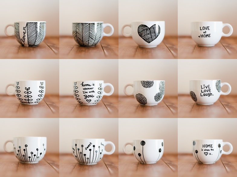Twelve square photos of white coffee mugs with black decorations drawn on form a 3x4 grid. Some of the mugs have words written on them, while others have hearts, flowers, and patterns drawn on them.