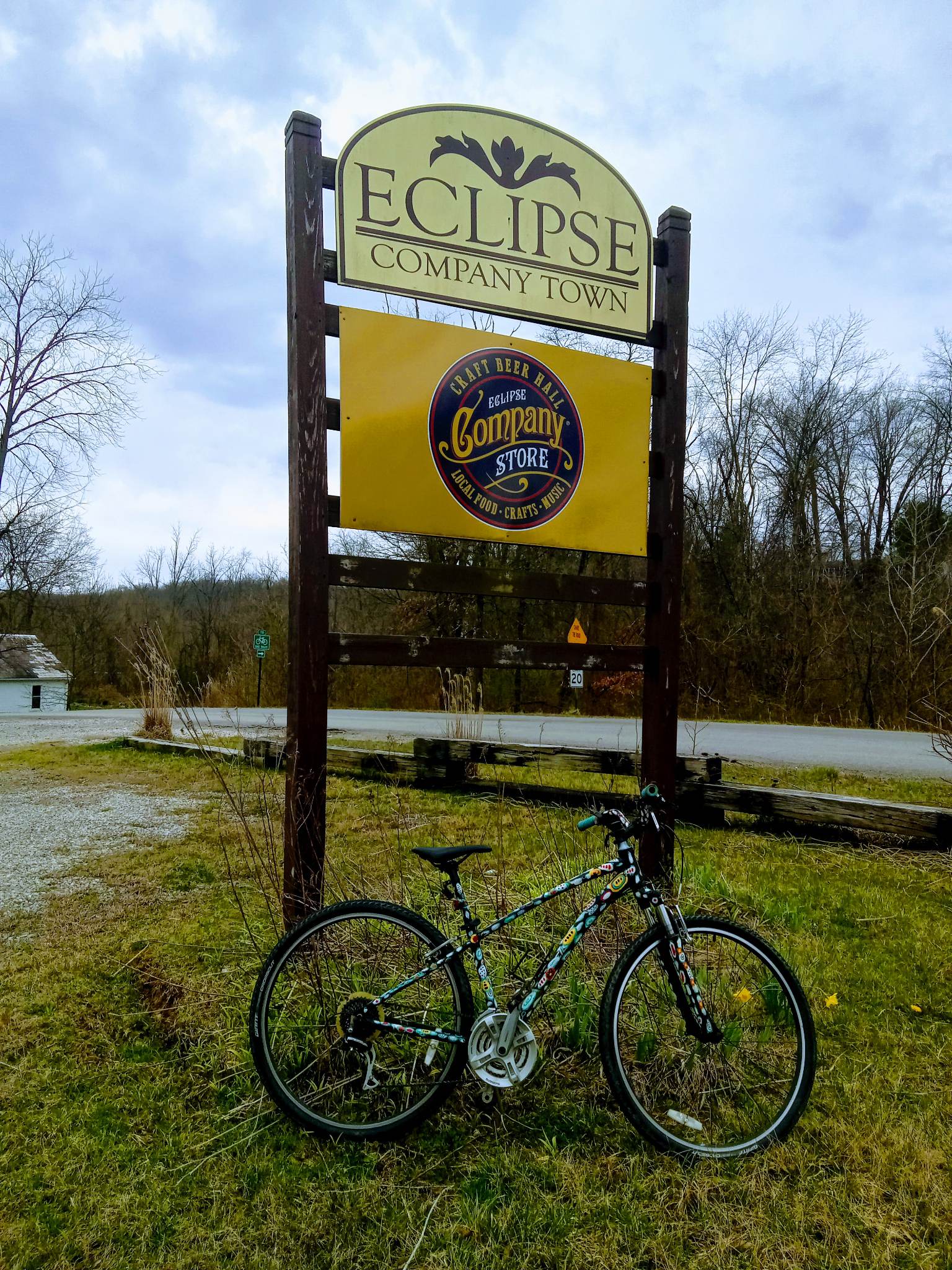 A picture of the Eclipse Company Store sign and a bike.