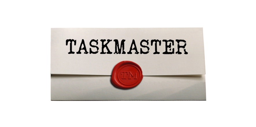 A cream-colored piece of paper is folded and sealed with a red wax "TM" seal. Above the seal the paper says "TASKMASTER."