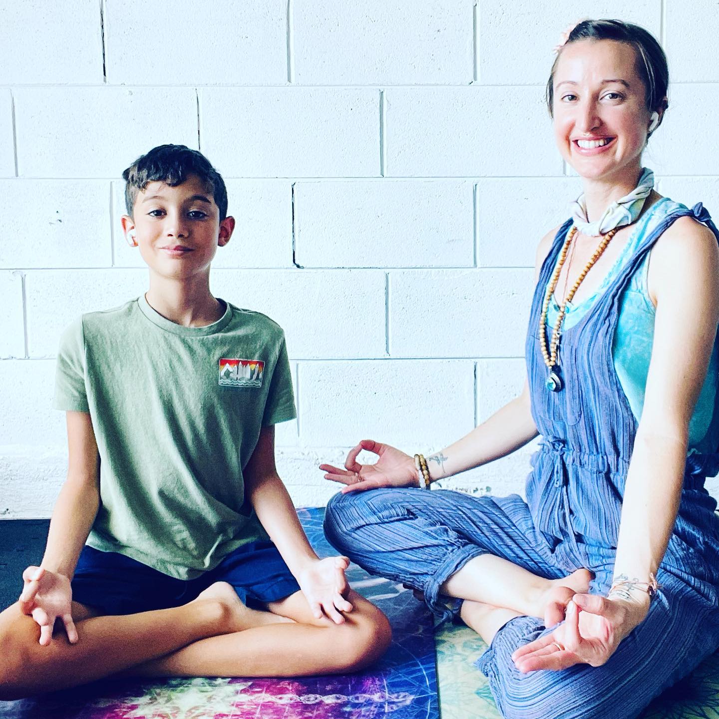 Yoga instructor with student.