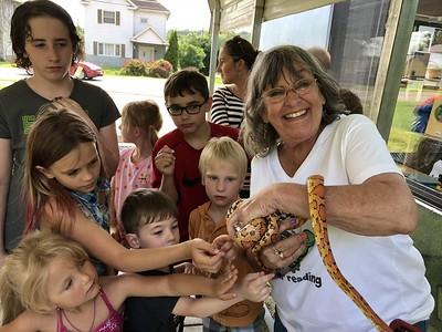 Presenter holds snake 