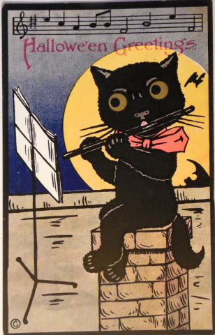 Vintage Halloween postcard depicting a cat playing a flute.