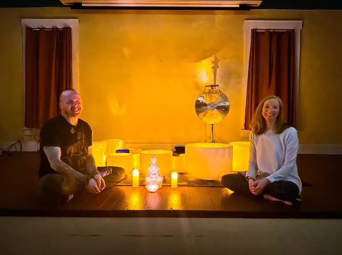 A picture of Kojun Hayes (left) and Michelle Greenfield with singing bowls