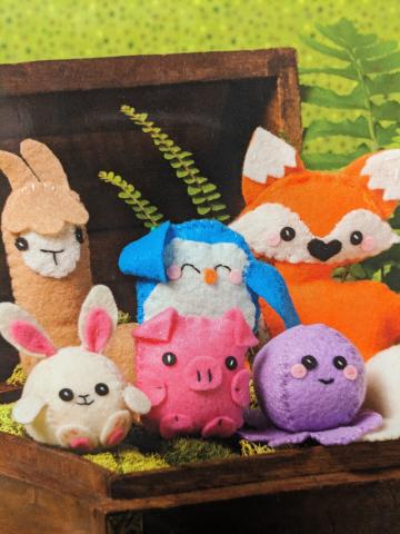 Miniature felt stuffed animals.