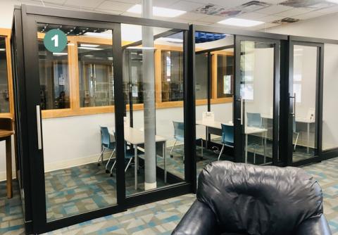 Photo showing three glass study cubicles with the first on the right labeled "1"