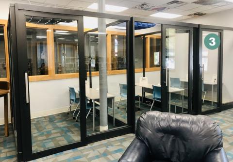 Photo showing three glass study cubicles with the first on the right labeled "3"