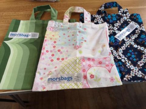 A picture of reusable cloth bags on a table