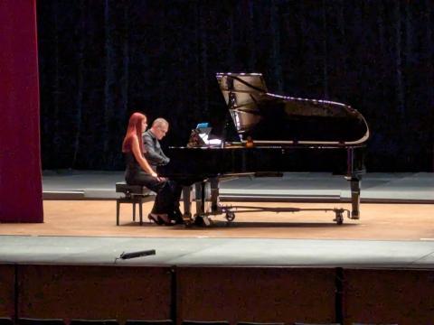 Featured international artists Dynamic Piano Duo on stage.