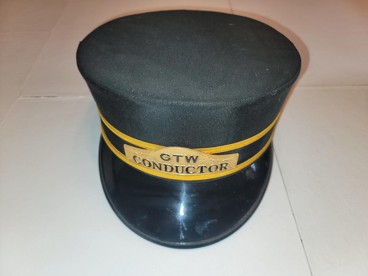 Vintage conductor's cap for passenger railway service.