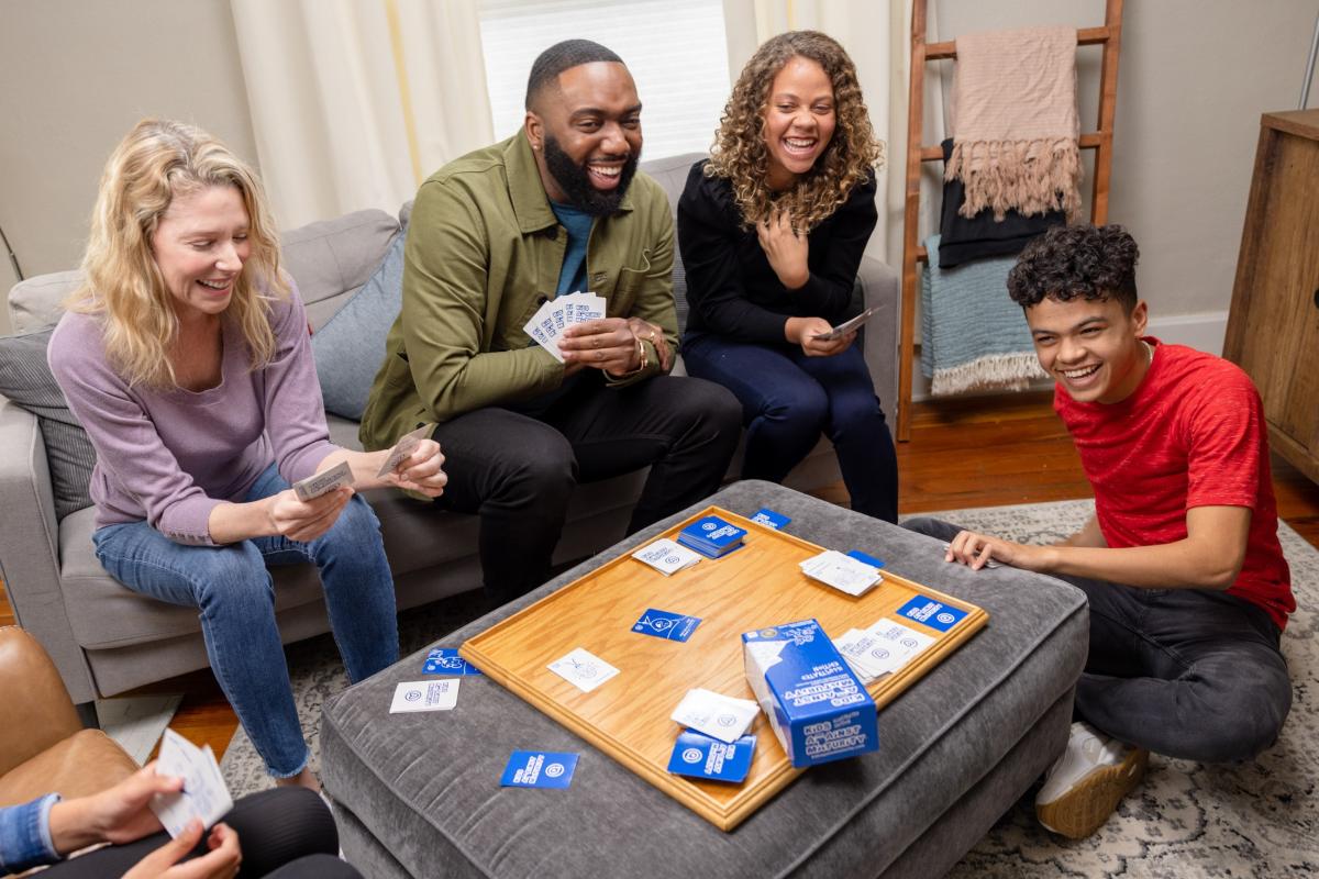 People having fun playing a card game