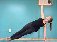 Human Doing Yoga in Front of Blue Wall