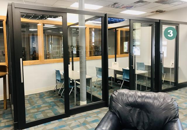Photo showing three glass study cubicles with the first on the right labeled "3"