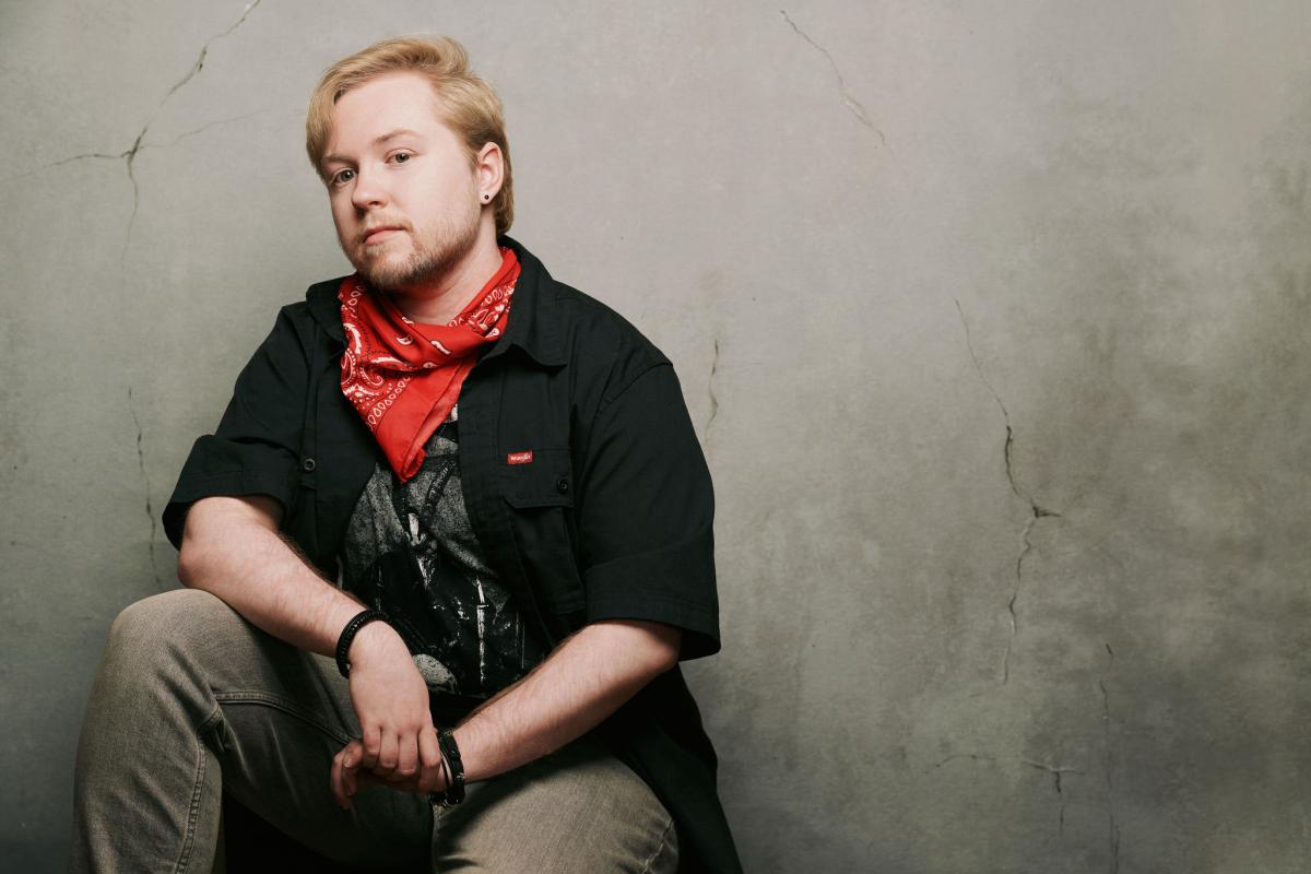 An image of the author. A blonde man wearing a red bandana.